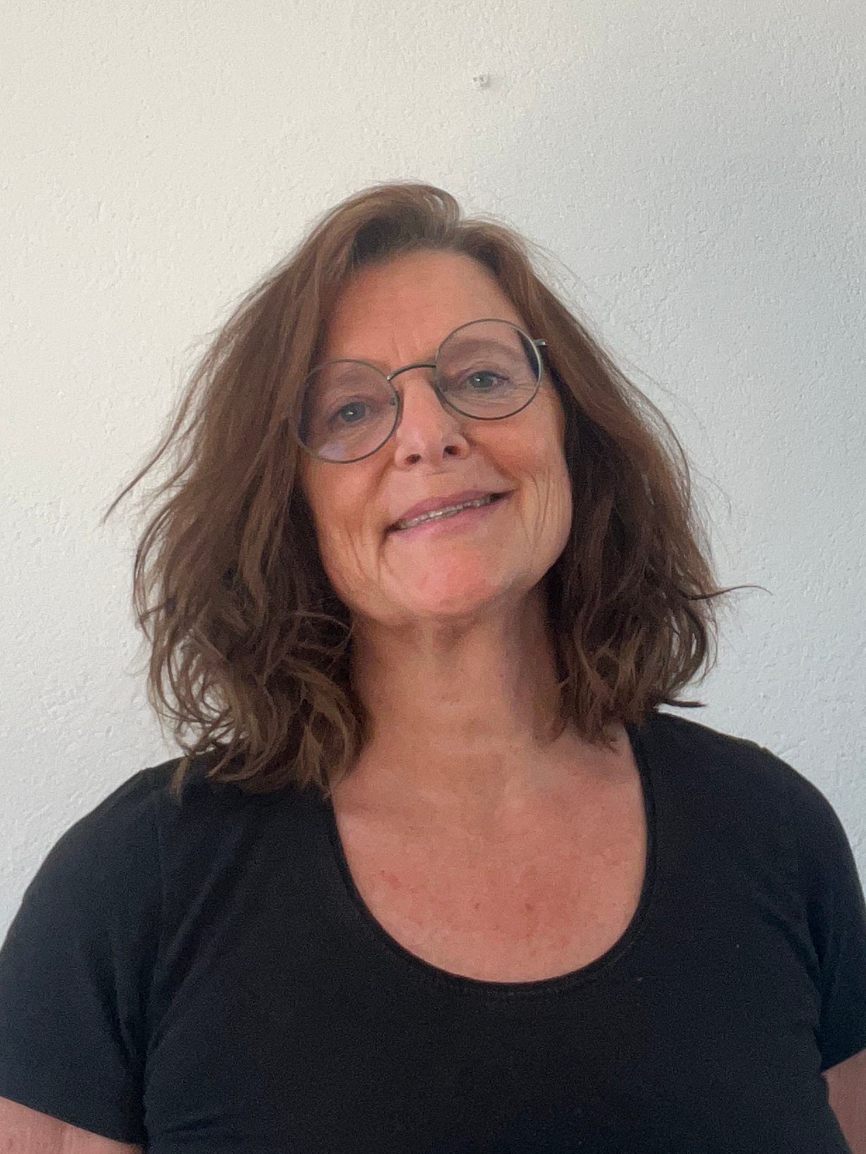 Portrait of &Aring;sa Backman with a white background.